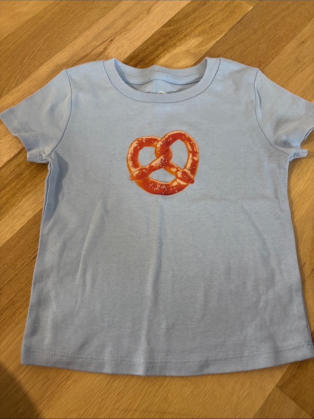 art class Light Blue Tee with Orange Pretzel Graphic size 8, never worn